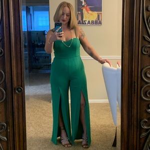 Bebe Kelly green jumpsuit with back zipper and slits in front leg up to knee
